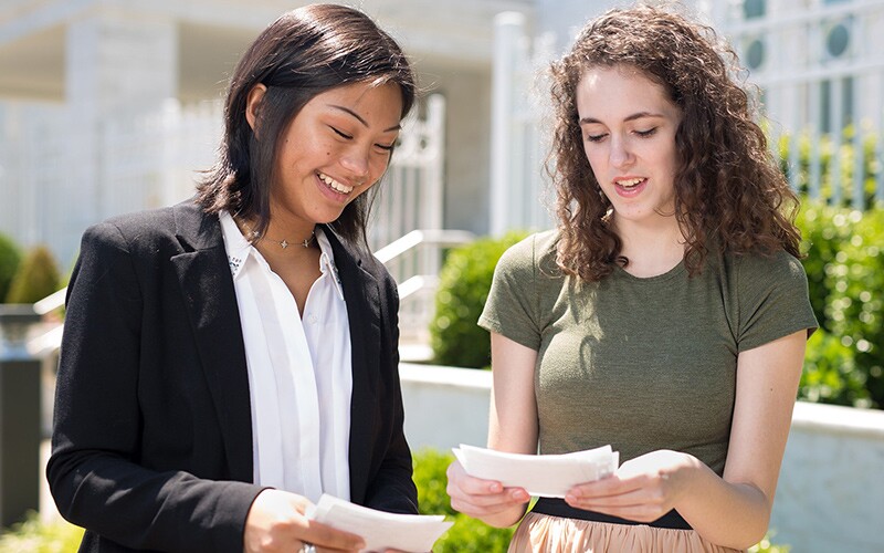 two women with ordinance cards at the temple.