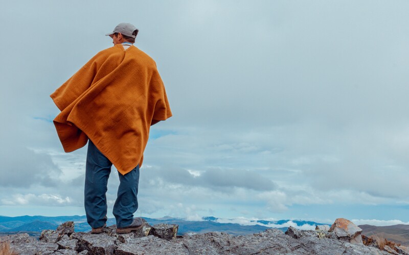 A man looking out into a landscape