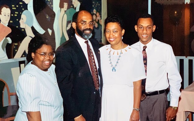Andre as a young man with his parents and sister