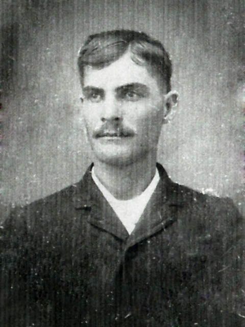 Old photograph of a man with a mustache.
