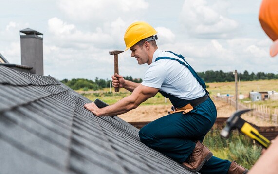 men fixing a roof 