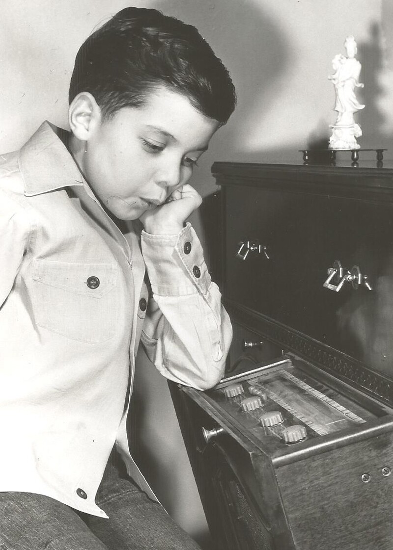 Little girl listens to radio