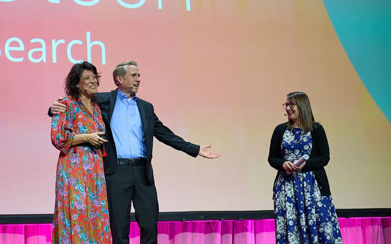 Me Ra Koh, Kirby Heyborne, and Tamara Stansfield on the Main Stage at RootsTech 2023