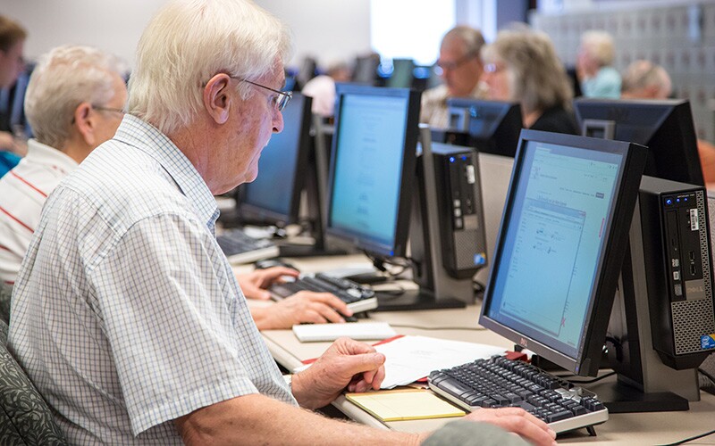 Guests looking up records at a FamilySearch center.