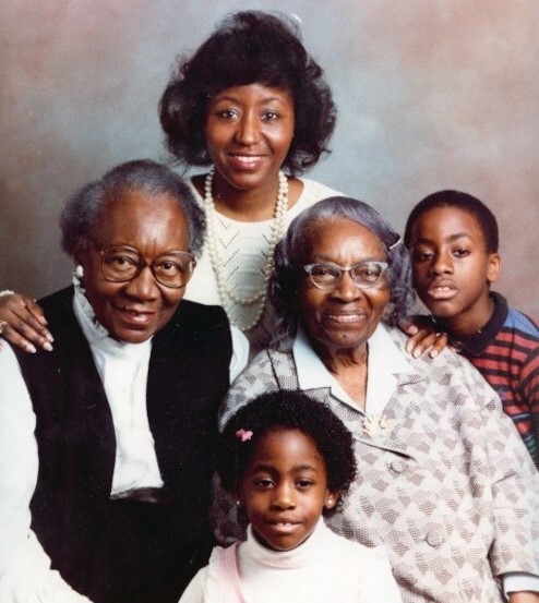 Bernice Bennett is surrounded by her mother, grandmother, and children.