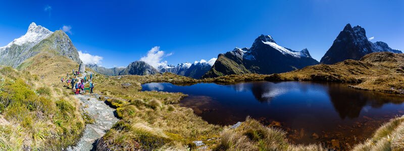 Hikers on the Milford Track in Fiordland National Park, New Zealand.