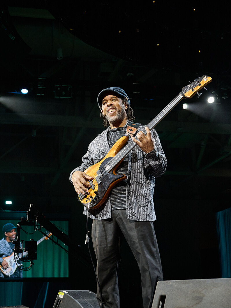 Victor Wooten holds his bass while presenting at the RootsTech 2025 Impact Forum.