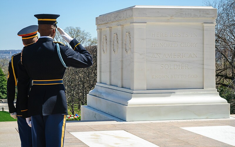 Tomb guards salute the Tomb of the Unknown Soldier.