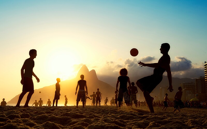 Soccer at sunset on the beach