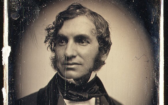An old sepia photograph of Henry Wadsworth Longfellow