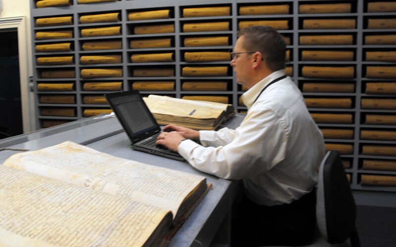David Rencher working on a memorial book at Register of Deeds.