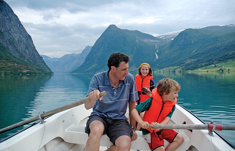 a family goes boating in norway.