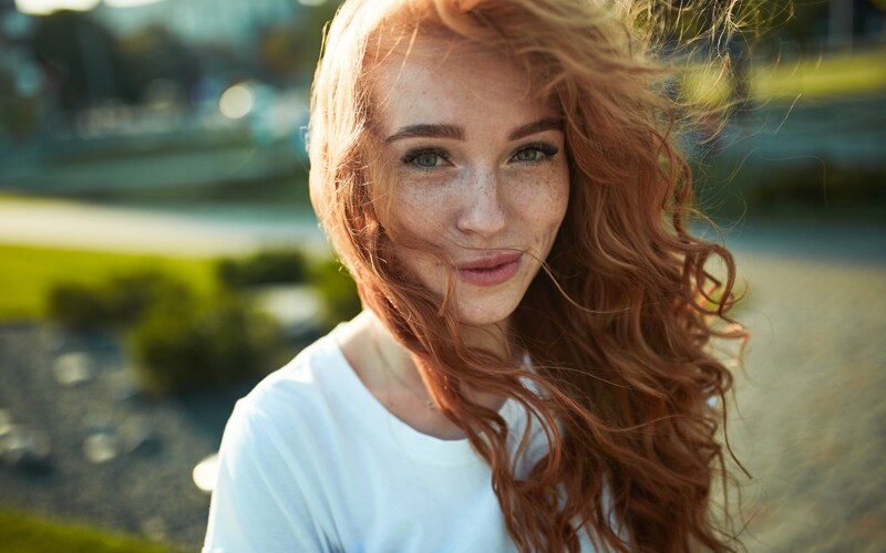 a girl with orange hair and freckles 