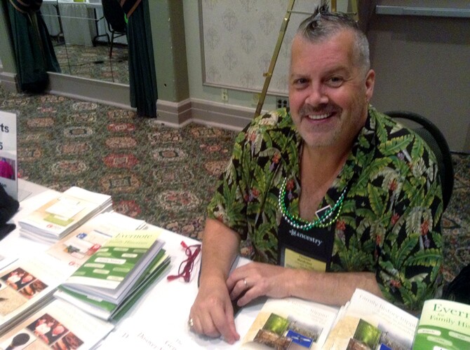 Thomas MacEntee at a table at Rootstech.