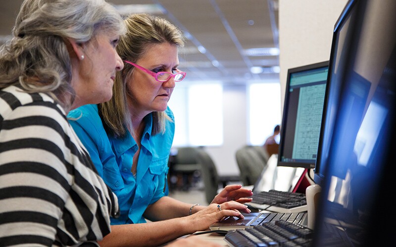 two women on a computer.