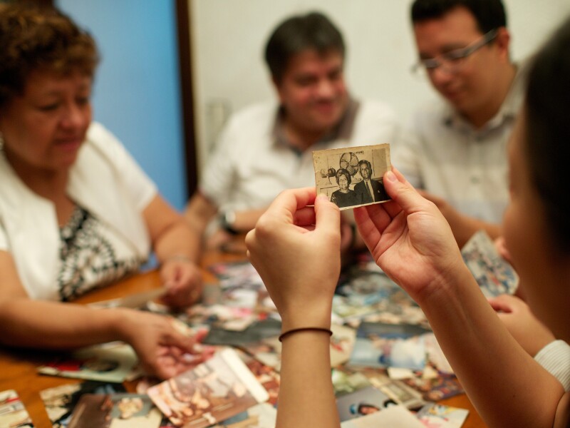 Family members looking at old family photos