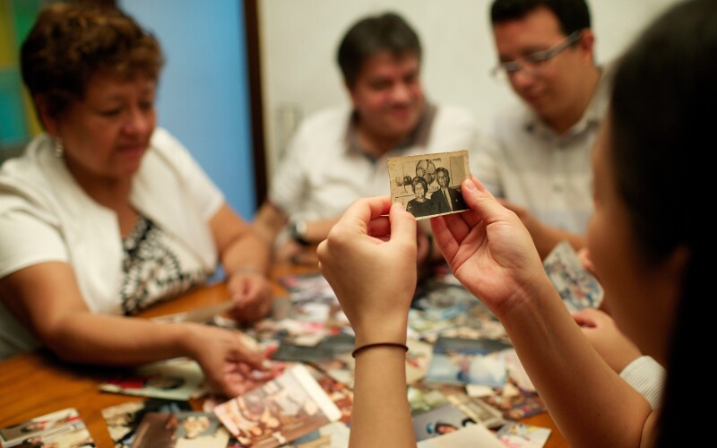 Family members looking at old family photos