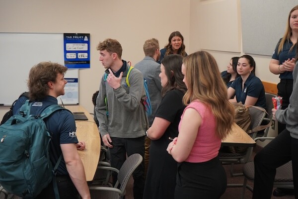 Teams participating in the 2025 BYU marketing case competition prepare to present their campaigns