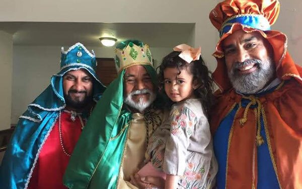 A family dressed as the Three Kings for 3 Kings Day