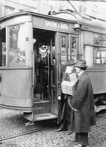 people wear masks on trolleys during the 1918 Spanish Flu pandemic.