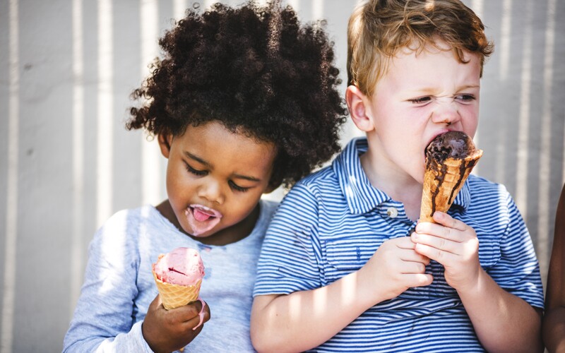 two boys eat ice cream