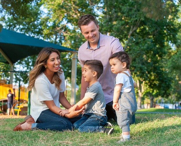 a family at the park together.