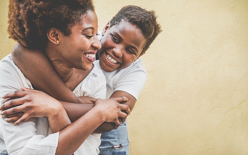 Mother and son smiling