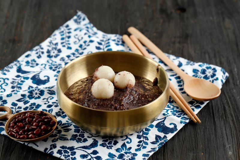 Patjuk, a traditional Korean red bean porridge with rice dumplings that is eaten on the winter solstice