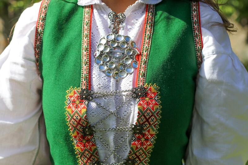 a modern bunad with traditional solje jewelry
